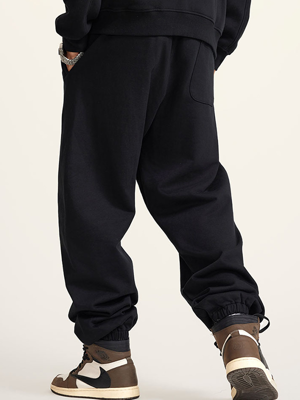 Pantalones deportivos básicos de color liso con pies atados para hombre-1